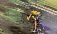 Maleri af en cykelrytter iført en gul trøje